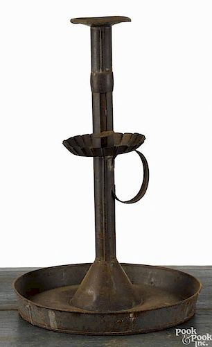 Large tin push-up candlestick, 19th c., with a mid-drip pan and a dish base, 14 3/4'' h.