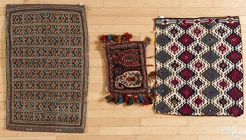 Two flat weave bagfaces, early 20th c.,3'2'' x 2' and 2'5'' x 2'2'' together with a saddlebag, with b