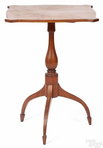 New England Federal cherry candlestand, ca. 1805, with a line inlaid serpentine tilt top and spade