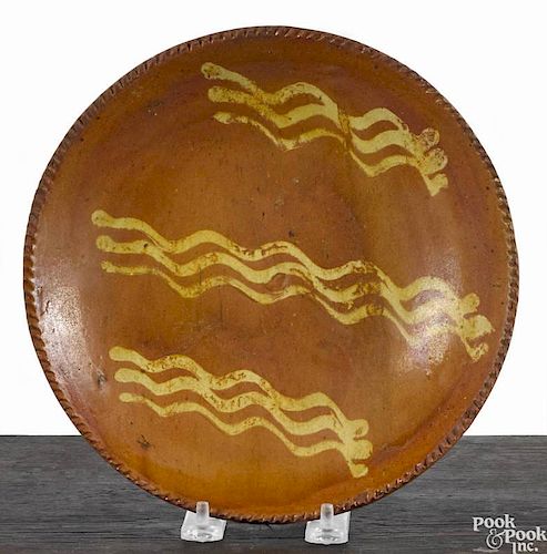 Pennsylvania redware pie plate, 19th c., with yellow slip decoration, 8 7/8'' dia.