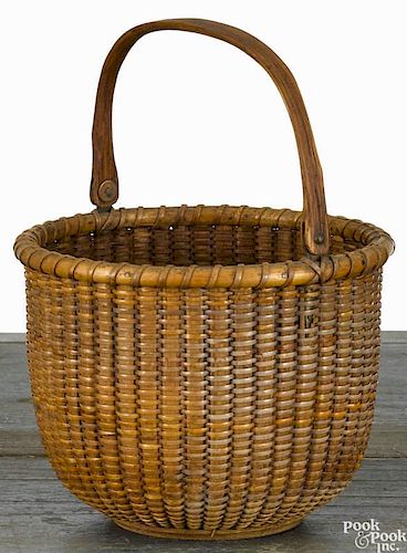 Nantucket lightship basket, ca. 1900, attributed to William Appleton, with a swing handle, 4'' h.