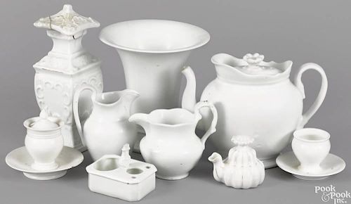 Group of undecorated Philadelphia Tucker porcelain, ca. 1825, to include a teapot, a vase, a cream