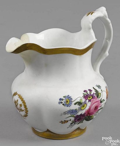 Philadelphia Tucker porcelain pitcher, ca. 1825, with floral and gilt decoration, 8 1/2'' h.