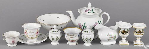 Group of porcelain wares, ca. 1825, probably Tucker, to include a teapot, pot de crèmes, a creamer