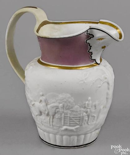 Philadelphia Tucker porcelain pitcher, ca. 1825, decorated with a relief hunting scene with gilt a