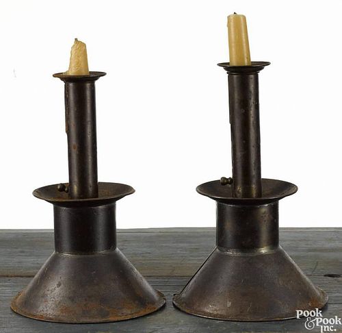 Near pair of weighted tin push-up candlesticks, 19th c., 9'' h. and 9 1/4'' h.