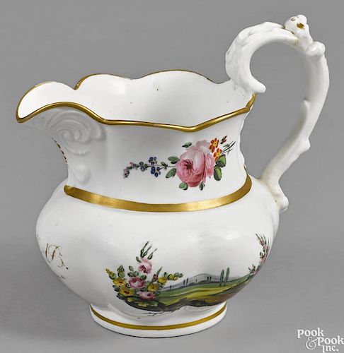 Philadelphia Tucker porcelain pitcher, ca. 1825, with floral and gilt decoration, 7 1/4'' h.