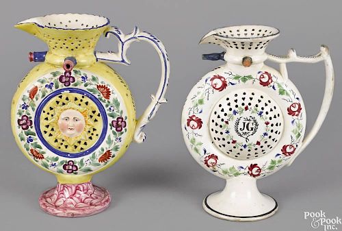 Two Staffordshire moon-shaped puzzle jugs, early 19th c., 10 1/2'' h. and 11'' h.