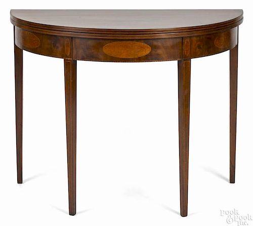 Federal mahogany demilune card table, ca. 1800, with oval inlaid panels, 28 1/4'' h., 36 1/2'' w.