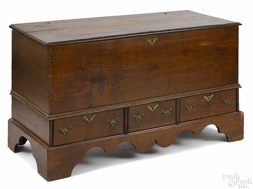 Pennsylvania Queen Anne walnut blanket chest, mid 18th c., with three drawers and a scalloped apro