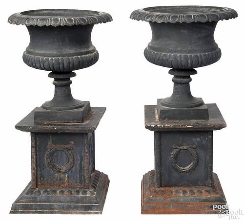 Pair of Victorian cast iron garden urns, 41'' h.
