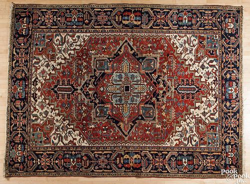 Heriz carpet, ca. 1920, 11'4'' x 8'4''.