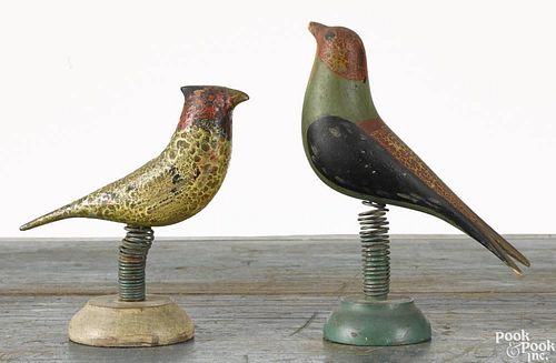 Two carved and painted birds, ca. 1900, each on a spring support with a turned wood base, 5 1/2'' h