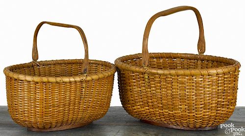 Two nesting Nantucket oval lightship baskets, early/mid 20th c., attributed to Mitchell Ray, 5 3/4