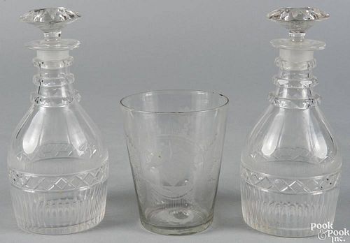Pair of Anglo-Irish cut glass decanters, mid 19th c., 9 1/2'' h., together with an engraved flip gl