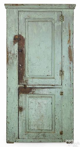 Pennsylvania painted pine cupboard, 19th c., retaining an old apple green surface, 72'' h., 33'' w.,