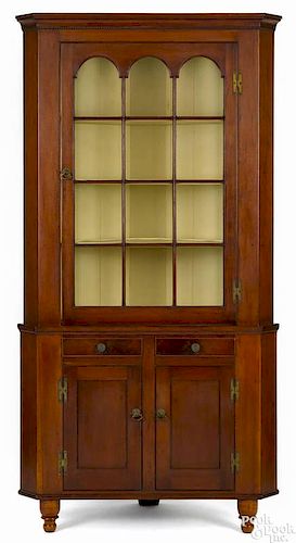 Pennsylvania Federal cherry two-part corner cupboard, ca. 1840, 84 1/2'' h., 42'' w.