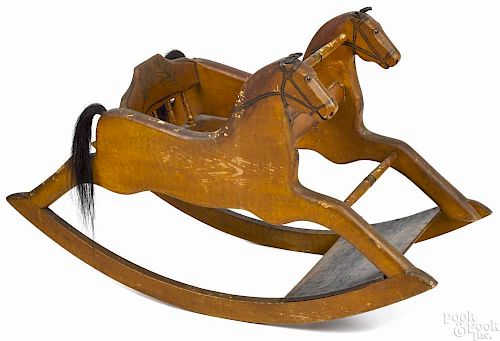 Carved and painted hobby horse, 19th c., retaining its original ochre decoration, 25 1/2'' h., 43''
