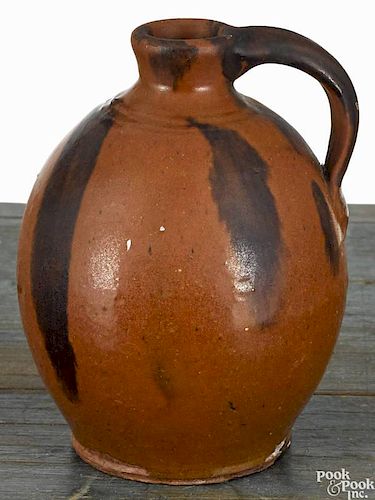 Small redware jug, 19th c., with manganese splash decoration, 5 1/2'' h.