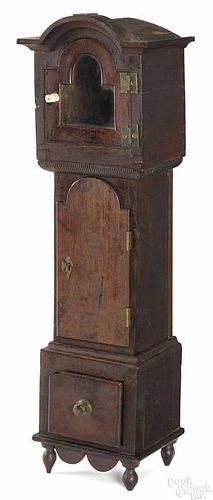Pennsylvania walnut tall case clock-form watch hutch, ca. 1800.