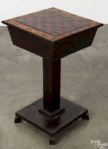 Carved and painted games table, late 19th c., with a removable gameboard top, fitted with a drawer