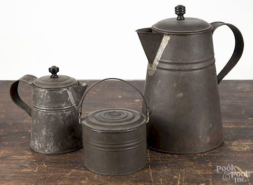 Three pieces of early American tin, 19th c. to include a coffeepot, 8 3/4'' h., a cream pitcher, 5 1/