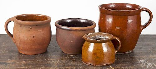 Four pieces of Pennsylvania redware, 19th c., largest 7 1/4''.