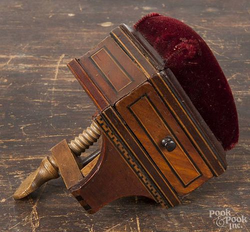 Inlaid mahogany pin cushion sewing clamp, 19th c., with a drawer over a Greek key border, 6'' h.