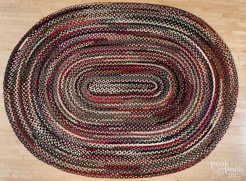 Large braided oval rug, 20th c., 12' x 8' 6''.