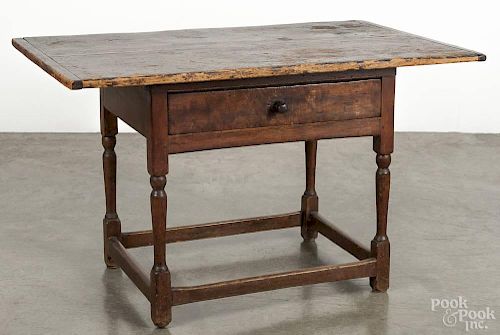 Pennsylvania pine tavern table, late 18th c., with a stretcher base, 27'' h., 47'' w., 27'' d.