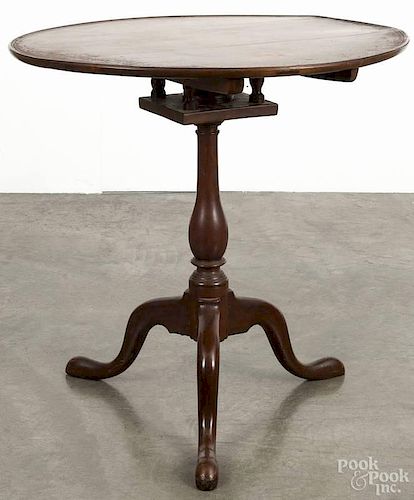 Pennsylvania Chippendale walnut tea table, ca. 1780, with a dish top over a birdcage support, 30'' h.