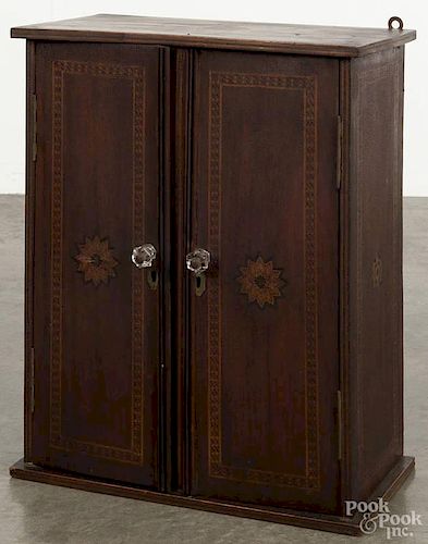 Inlaid walnut hanging cupboard, 19th c., with parquetry inlay, 21'' h., 15 1/2'' w.
