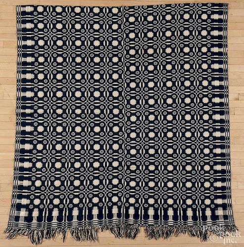 Two blue and white overshot coverlets, mid 19th c., with a pine tree border, 96'' x 76'' and 74'' x 80''
