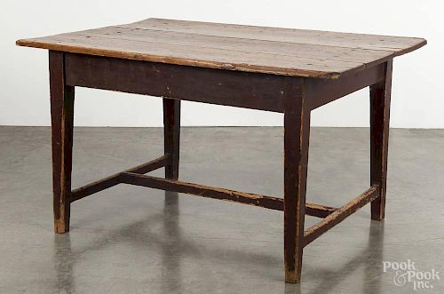 Pennsylvania painted pine work table, 19th c., with a stretcher base, retaining an old red surface,