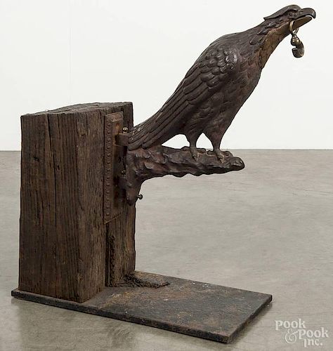 Figural cast iron eagle apothecary globe bracket, 19th c., mounted to a wood and steel block, overal
