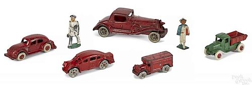 Five small cast iron vehicles