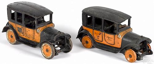 Two Arcade cast iron Yellow Cabs