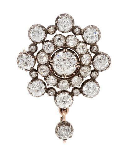 A Victorian Silver Topped Gold and Diamond Pendant Brooch, 6.80 dwts.