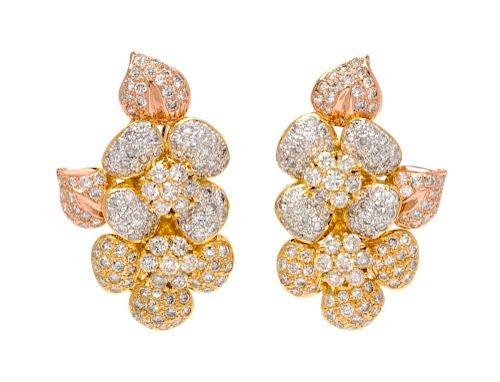 A Pair of 18 Karat Bicolor Gold and Diamond Earclips, 18.50 dwts.