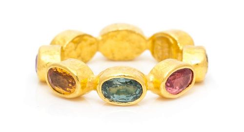 A 23 Karat Yellow Gold and Fancy Sapphire Eternity Band, 3.85 dwts.