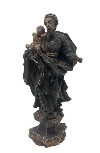 A Renaissance Carved Wooden Figurine of a Man with a Child