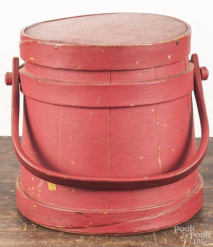 Painted pine firkin, ca. 1900, retaining a later red over a mustard surface, 9 1/2'' h.