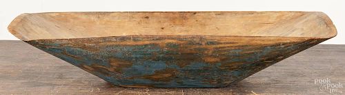 Painted pine trencher, 19th c., retaining a blue surface, 23 1/2'' w., 10'' d.
