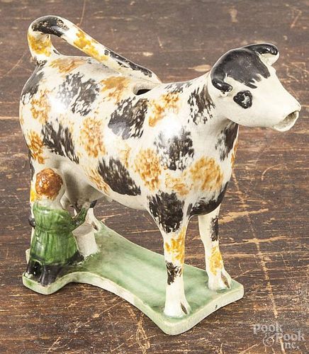 Prattware cow creamer, early 19th c., with sponged decoration, 6 1/2'' l.