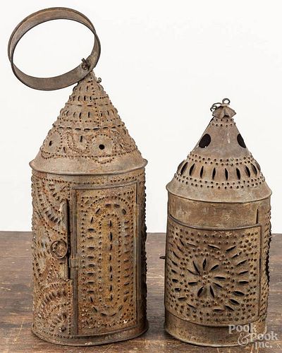 Two punched tin carry lanterns, 19th c., 16 1/2'' h. and 11'' h.