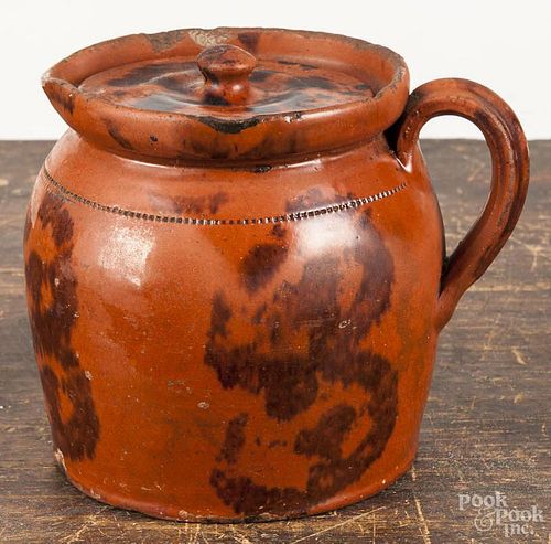 Pennsylvania redware covered pitcher, 19th c., with manganese splotching, 6'' h.
