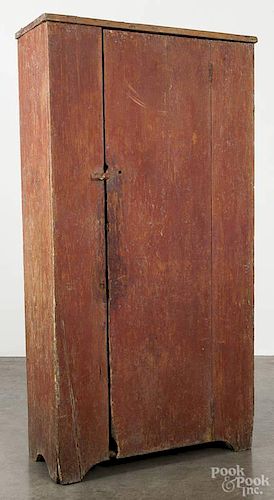 New England painted pine cupboard, 19th c., retaining a red dry scraped surface, 68 1/2'' h., 35'' w.