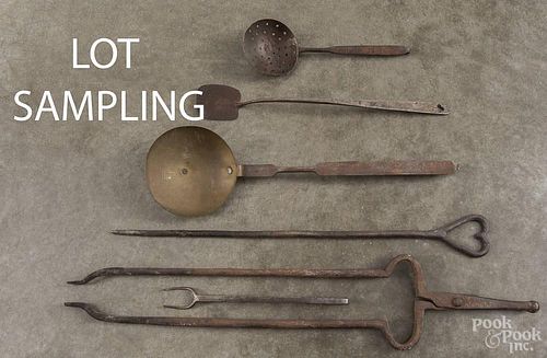 Collection of fifteen wrought iron utensils, 19th/20th c., together with fireplace tongs.