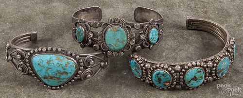 Three Navajo silver and turquoise bracelets.