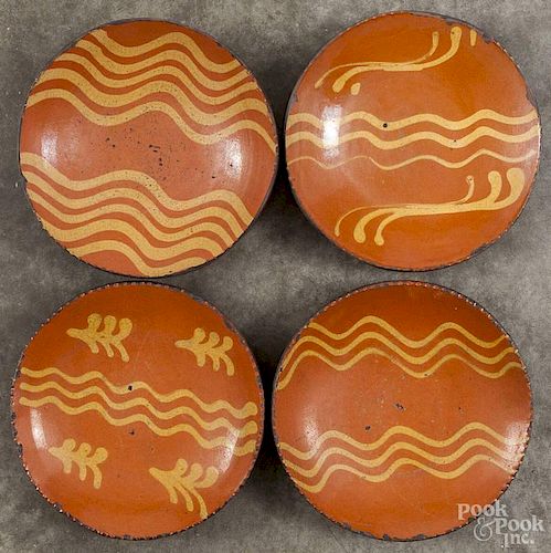 Four Greg Shooner redware plates, signed and dated 1999, 8 1/4'' dia.
